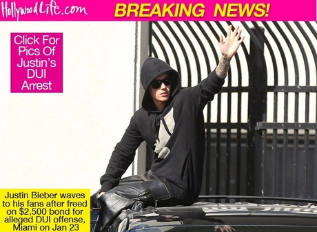 justin-bieber-climbs-on-car-and-waves-to-fans-as-he-leaves.jpg